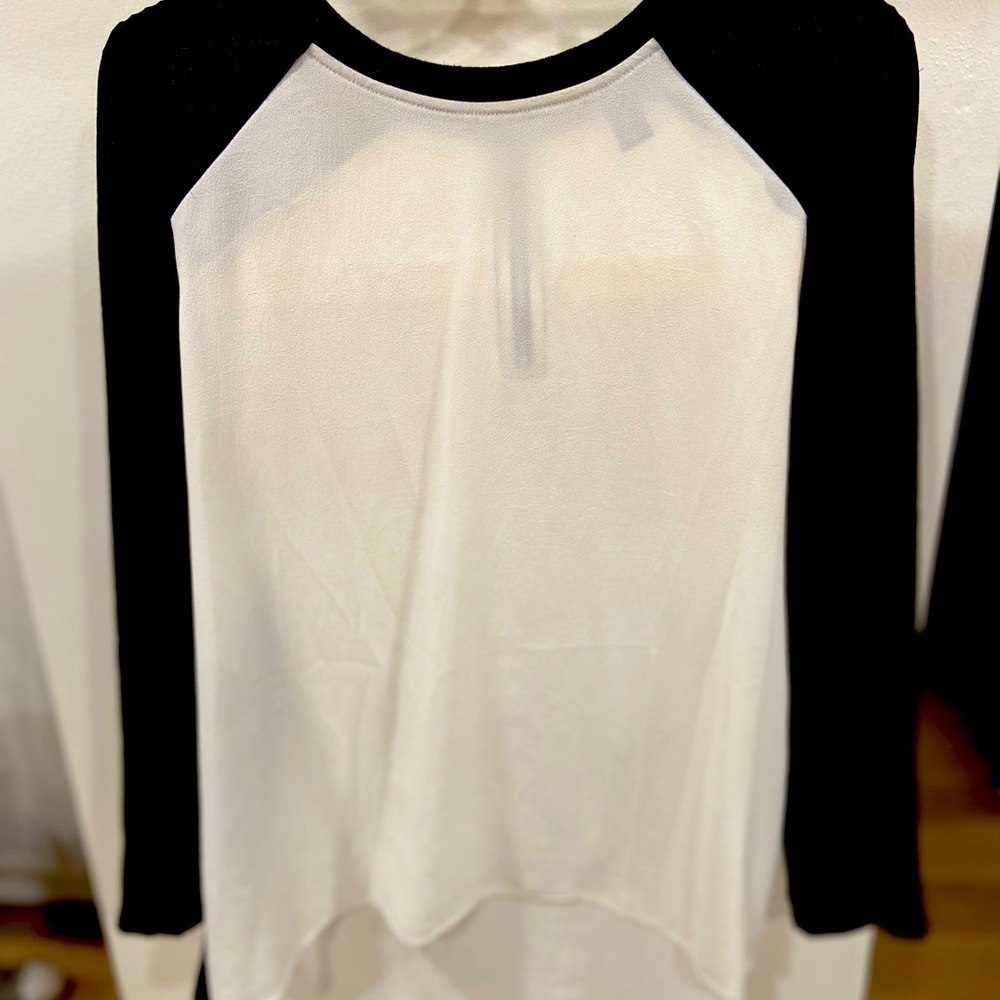 Black sleeves and white blouse with zipper back